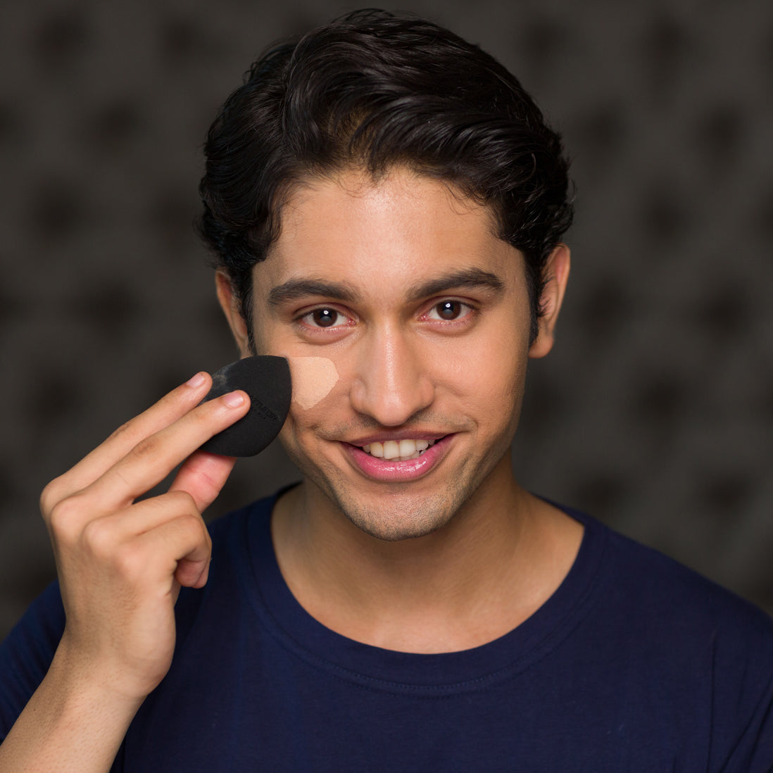 Men’s cosmetic kit with foundation, brush, and tinted moisturizer