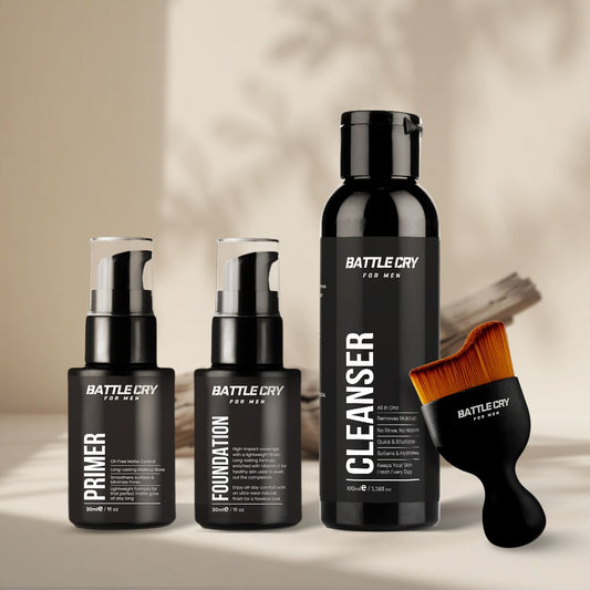 Set of Battle Cry including Primer, Foundation, and Cleanser with a brush on a neutral background.